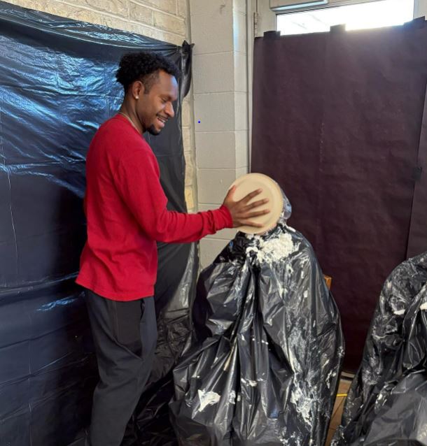 a man throws a pie in someone's face