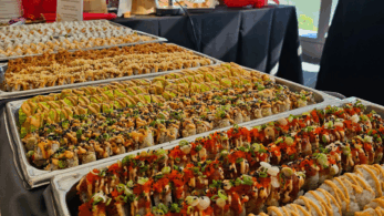 Rows of sushi on a table at a Parkhurst pop-up event