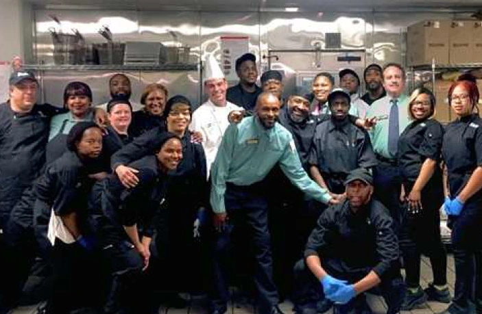 Parkhurst team members gather in the kitchen, ready to embrace their value of culture.
