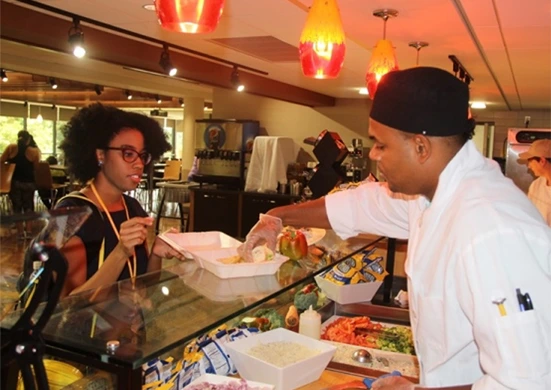 Parkhurst chef serves guest with a meal made with care.