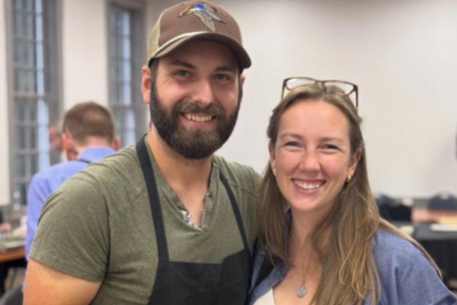 Hanover Dining team members hold a tray of bread