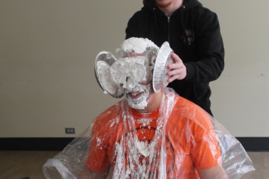 a Parkhurst team member gets pied in the face by another team member