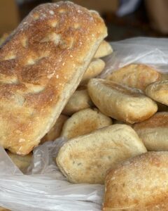 stacks of bread and roles are just a few of the things Mediterra specializes in