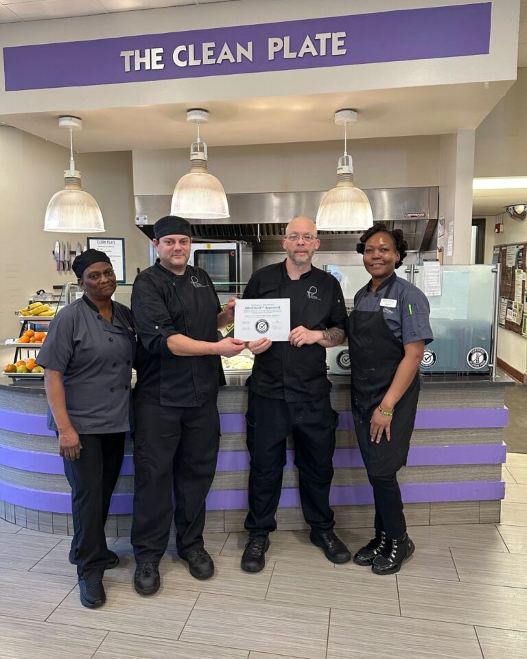 parkhurst team members standing in front of clean plate station