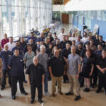 A large group of Parkhurst chefs gather at Family Meal event