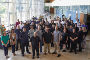 A large group of Parkhurst chefs gather at Family Meal event