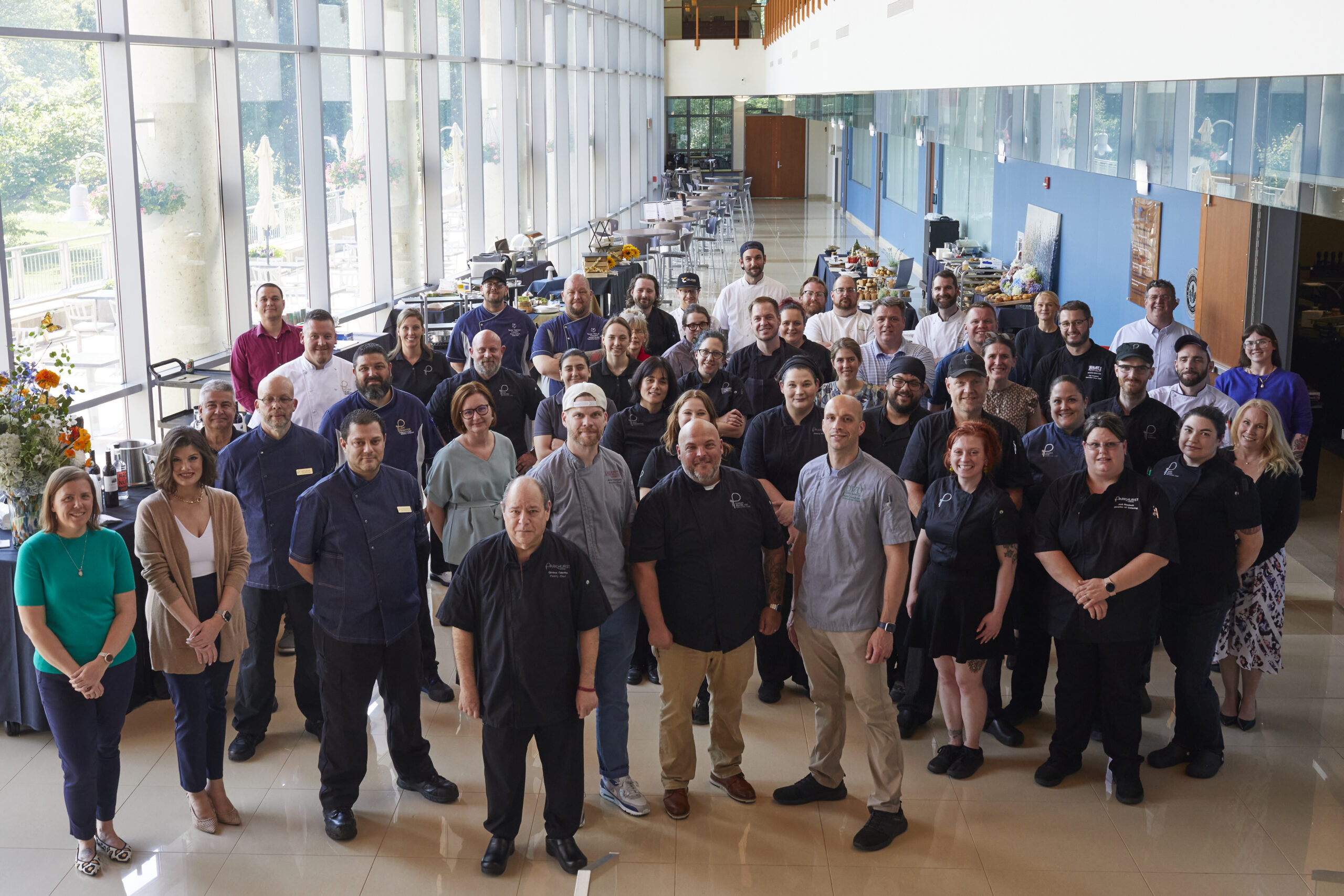 A large group of Parkhurst chefs gather at Family Meal event