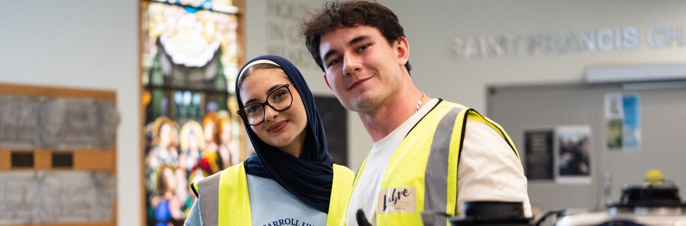 volunteers give thumbs up