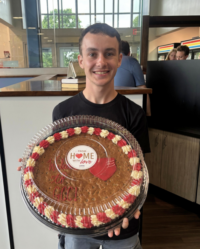 Student holding Cookie Cake