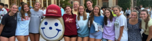 Group of Students with their arms around each other and the Eat'n Park Smiley Cookie