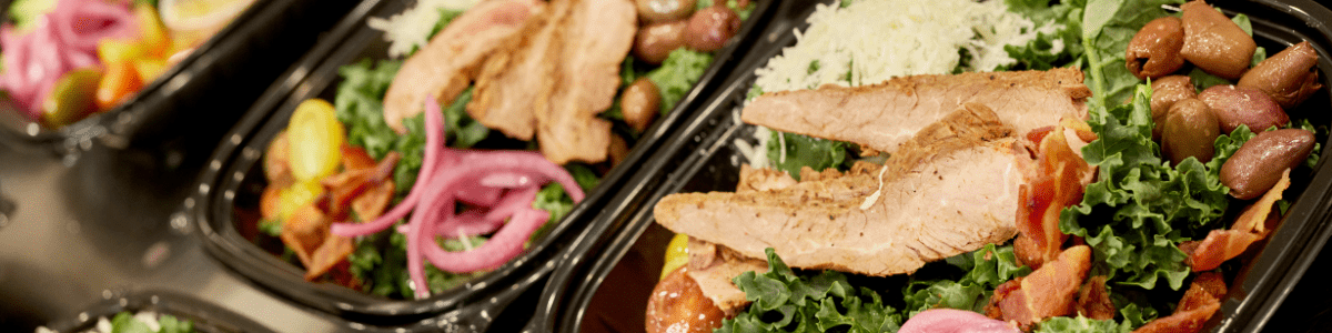 a series of steak salads lined up in rows