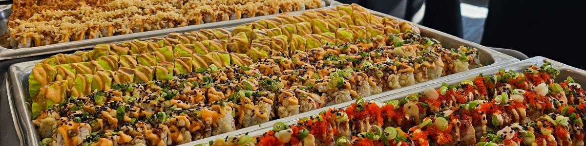 Rows of sushi on a table at a Parkhurst pop-up event