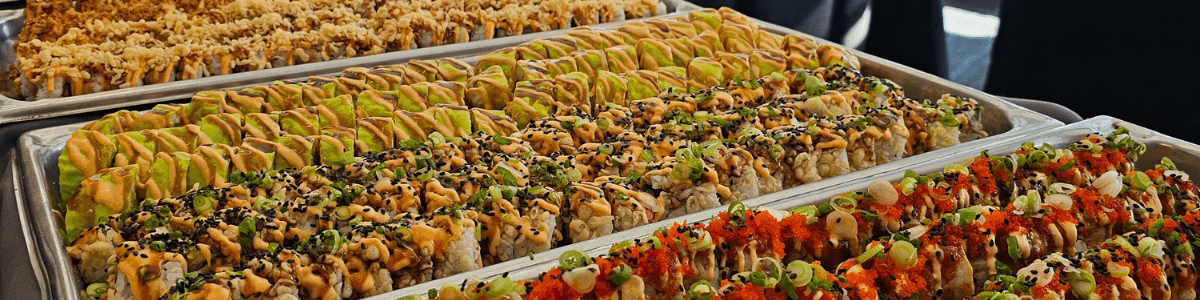Rows of sushi on a table at a Parkhurst pop-up event